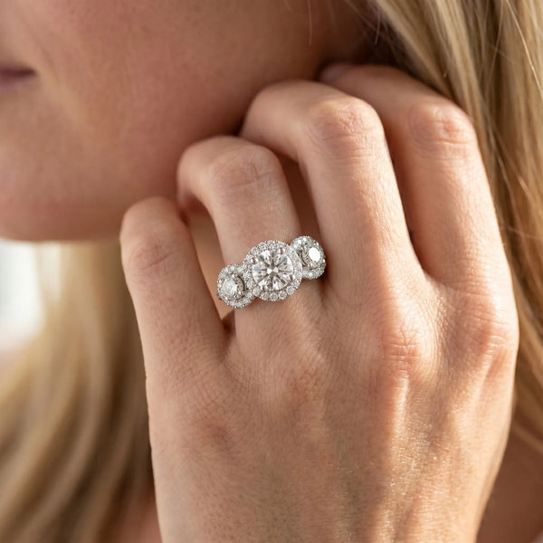 White gold Round Diamond Three-Stone Halo Ring with Prong Setting and Pavé Band
