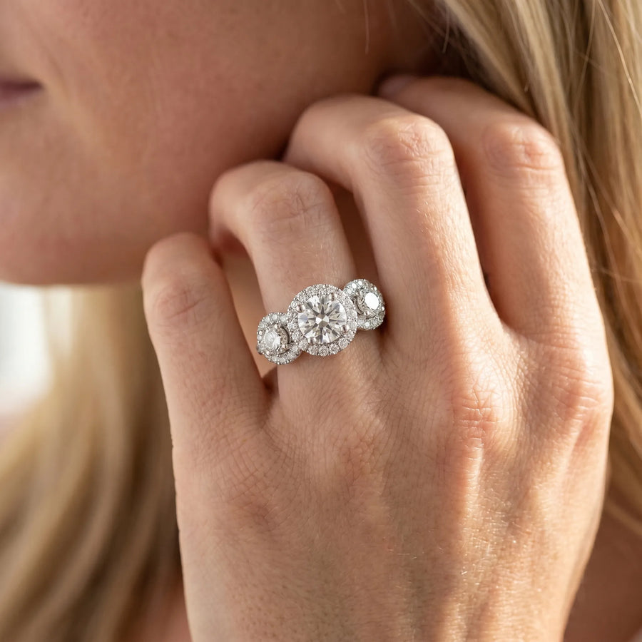 White gold Round Diamond Three-Stone Halo Ring with Prong Setting and Pavé Band