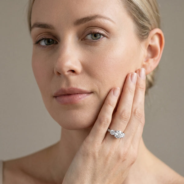 White gold Round Diamond Three-Stone Ring with Four-Prong Setting and Pavé Band