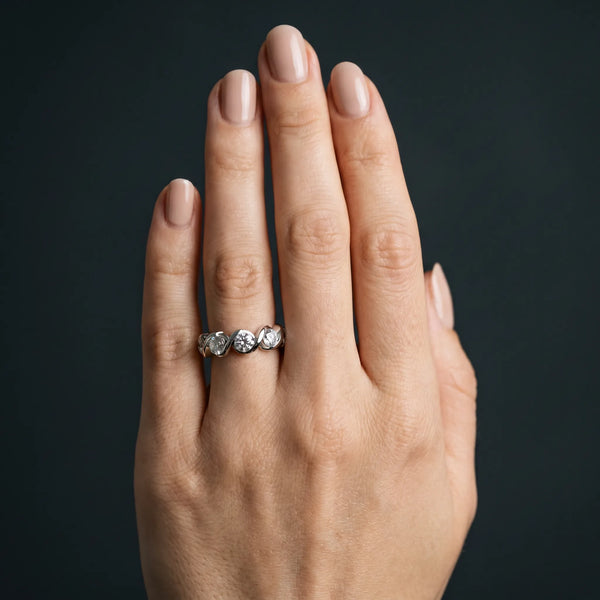 Platinum Round Diamond Wave Band with Channel Setting and Shared Prongs