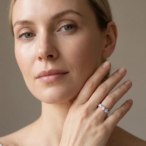 Platinum Round Diamond Wave Band with Channel Setting and Shared Prongs