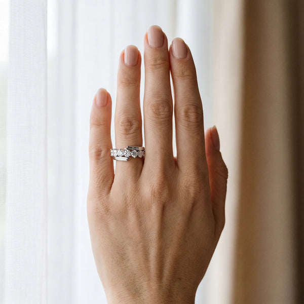 Platinum Round Diamond Wave Band with Channel and Shared Prong Setting