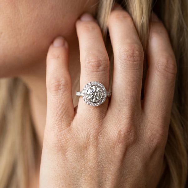 White gold Round Halo Diamond Engagement Ring with Bezel Setting and Pavé Band