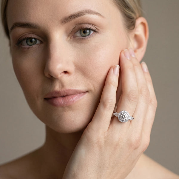 White gold Round Halo Three-Stone Diamond Ring with Pear Side Stones and Four-Prong Setting