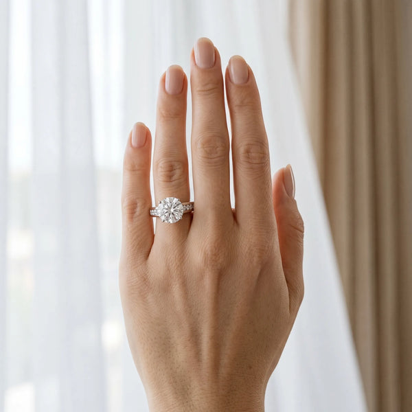 White gold Round Solitaire Channel-Set Diamond Engagement Ring with Four-Prong Setting