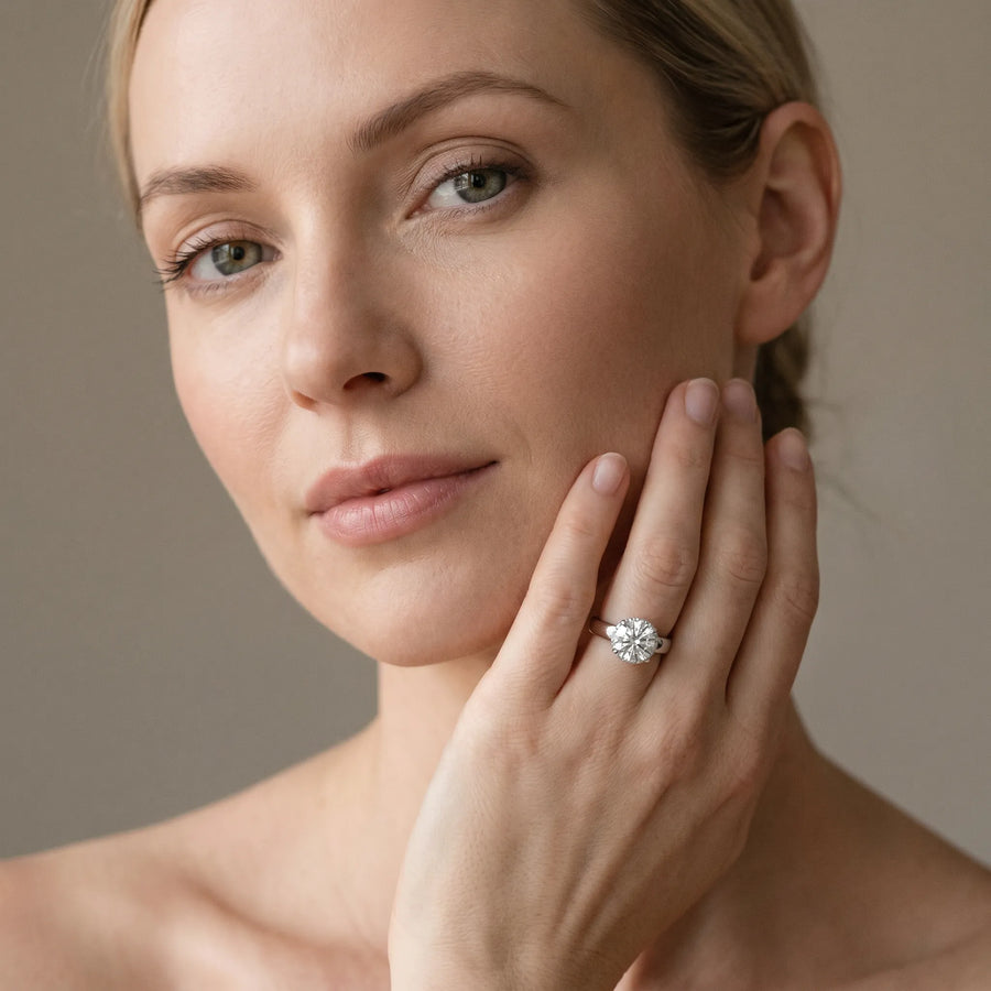 White gold Pear Cut Solitaire Diamond Engagement Ring with Four-Prong Setting and Tapered Band