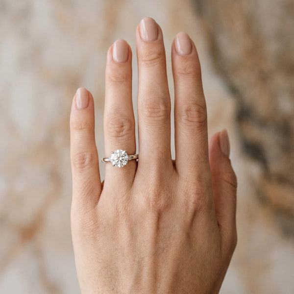 White gold Round Solitaire Diamond Engagement Ring with Twisted Pave Band and Four-Prong Setting