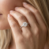 White gold Round Solitaire Diamond Engagement Ring with Twisted Pave Band and Four-Prong Setting
