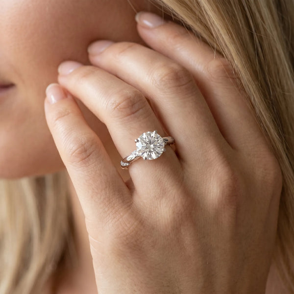 White gold Round Solitaire Diamond Engagement Ring with Twisted Pave Band and Four-Prong Setting