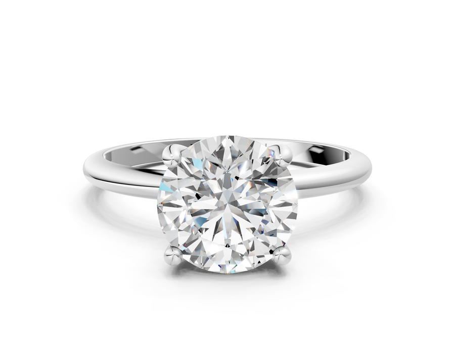White gold Round Solitaire Diamond Ring with 4-Prong Setting on a Classic Band