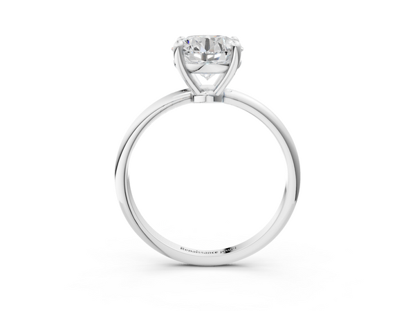 White gold Round Solitaire Diamond Ring with 4-Prong Setting on a Classic Band