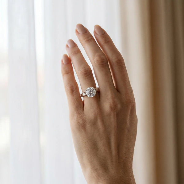 White gold Round Solitaire Diamond Ring with Cathedral Band and Four-Prong Setting