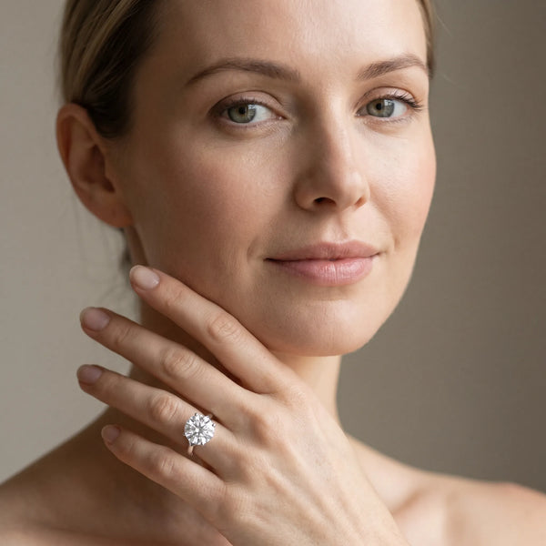 White gold Round Solitaire Diamond Ring with Cathedral Band and Four-Prong Setting