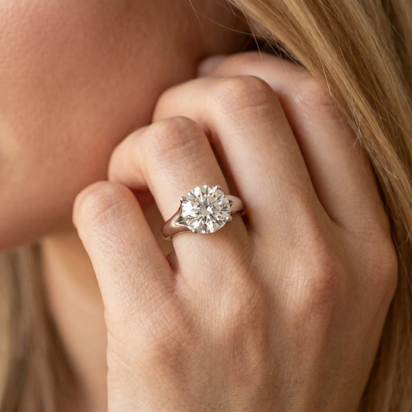 White gold Round Solitaire Diamond Ring with Cathedral Band and Four-Prong Setting