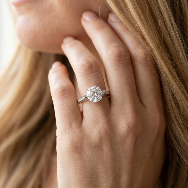 White gold Round Solitaire Diamond Ring with Channel Set Band and Bezel Prong Setting