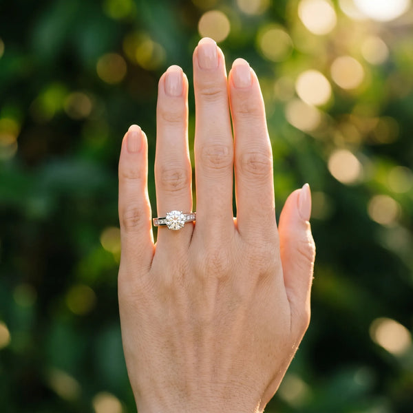 White gold Round Solitaire Diamond Ring with Channel-Set Band and Four-Prong Setting