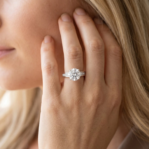 White gold Round Solitaire Diamond Ring with Channel-Set Band and Four-Prong Setting