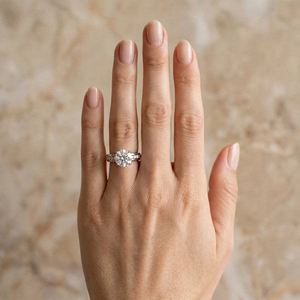White gold Round Solitaire Diamond Ring with Channel Set Band and Six-Prong Setting