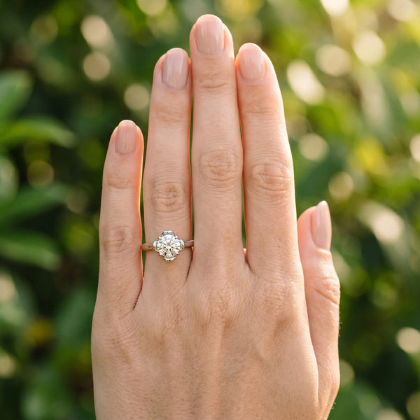 White gold Round Solitaire Diamond Ring with Floral Prong Setting and Classic Band