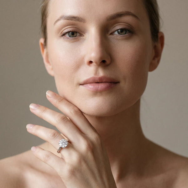 White gold Round Solitaire Diamond Ring with Four-Prong Setting and Tapered Band