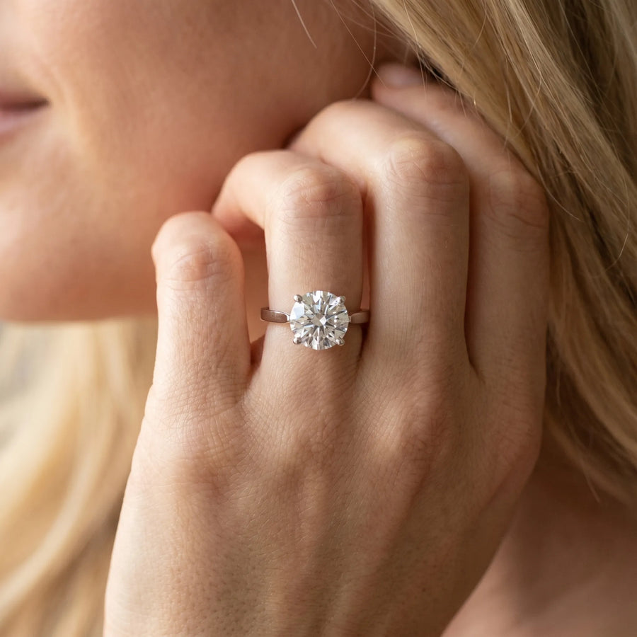 White gold Round Solitaire Diamond Ring with Four-Prong Setting and Tapered Band