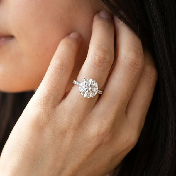 White gold Round Solitaire Diamond Ring with Four-Prong Setting on a Plain Band