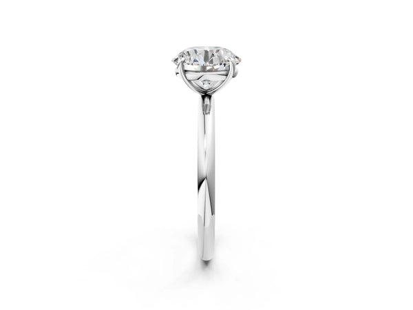 White gold Round Solitaire Diamond Ring with Four-Prong Setting on a Plain Band