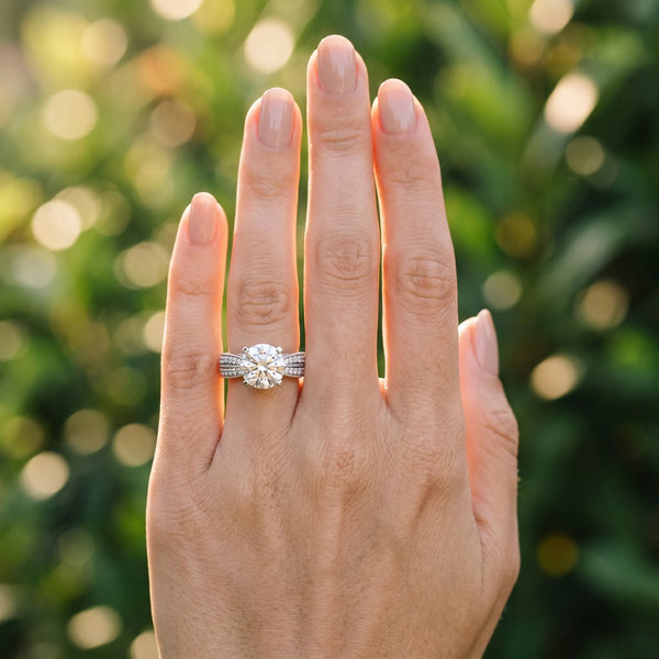 White gold Round Cut Diamond Solitaire Ring with Milgrain Round Pavé Band and Prong Setting