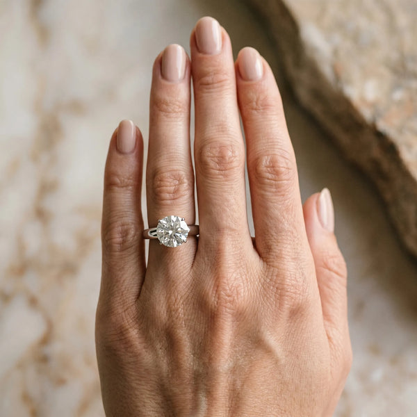 White gold Round Solitaire Diamond Ring with Tapered Band and Four-Prong Setting