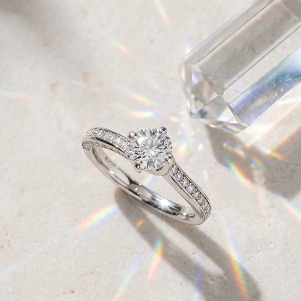 White gold Round Solitaire Diamond Twist Band with Pavé Setting and Four-Prong Setting