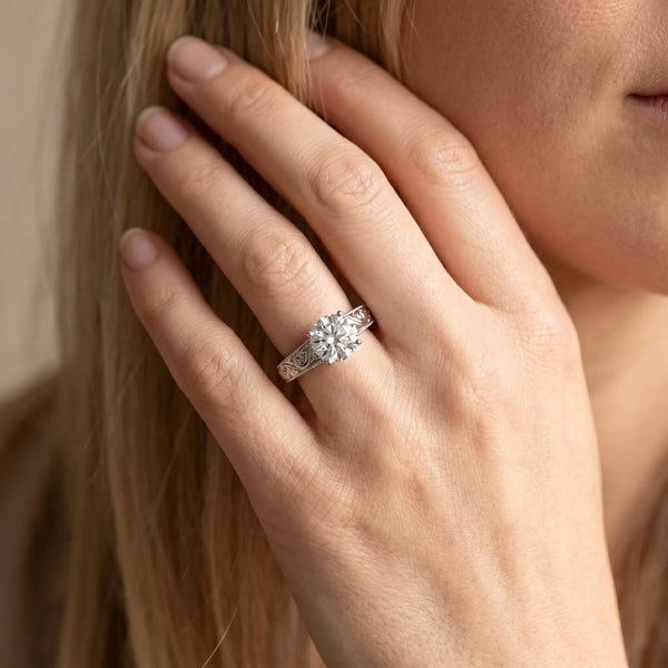 White gold Round Solitaire Diamond with Engraved Band and Four-Prong Setting