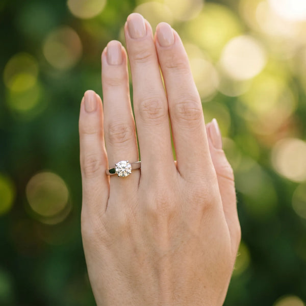 White gold Round Solitaire Engagement Ring with Tapered Band and Four-Prong Setting