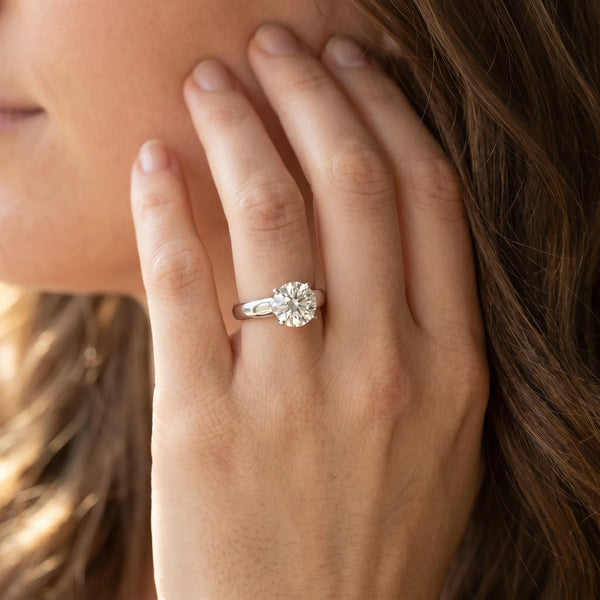 White gold Round Solitaire Engagement Ring with Tapered Band and Four-Prong Setting