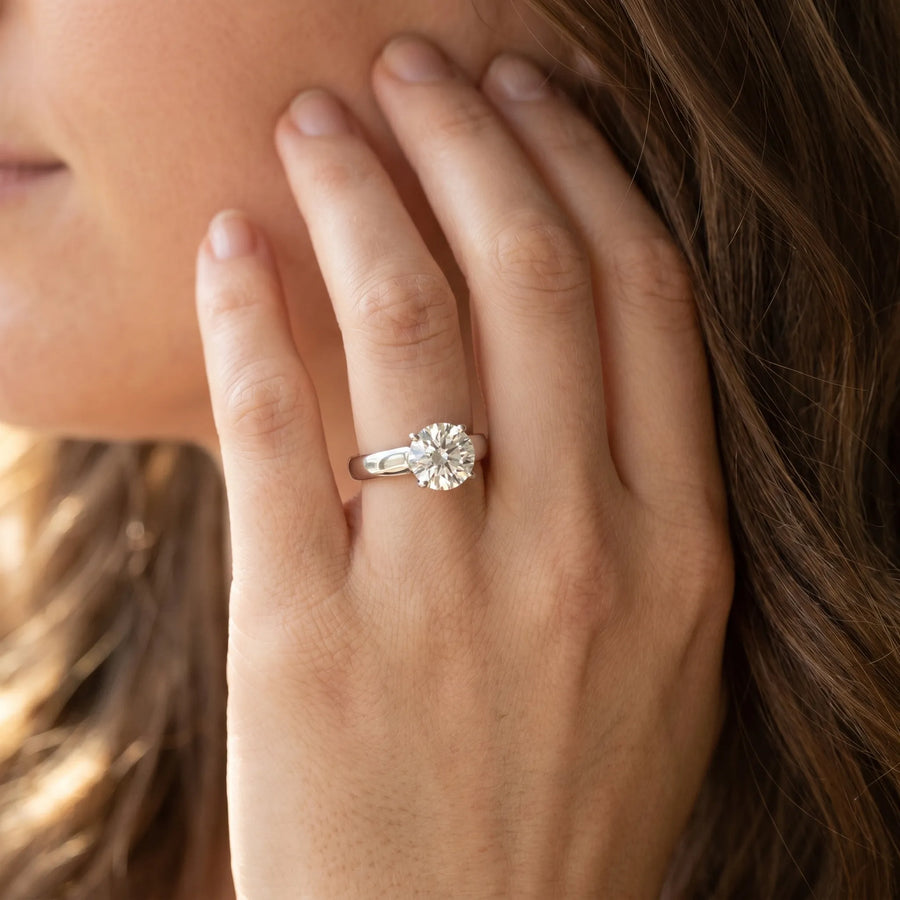 White gold Round Solitaire Engagement Ring with Tapered Band and Four-Prong Setting