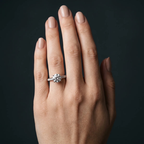White gold Round Solitaire Prong Set Diamond Engagement Ring with Pave Band