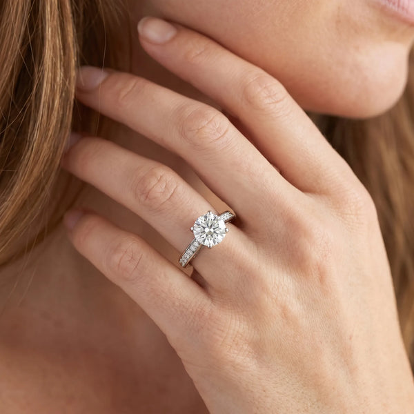 White gold Round Solitaire Prong Set Diamond Engagement Ring with Pave Band