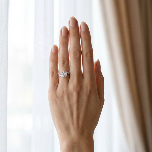 White gold Round Solitaire Twist Band with Channel Set Diamonds and Four-Prong Setting