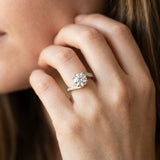 White gold Round Solitaire Twist Band with Channel Set Diamonds and Four-Prong Setting_19