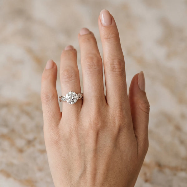 White gold Round Solitaire Twist Band with Leaf Prong Setting