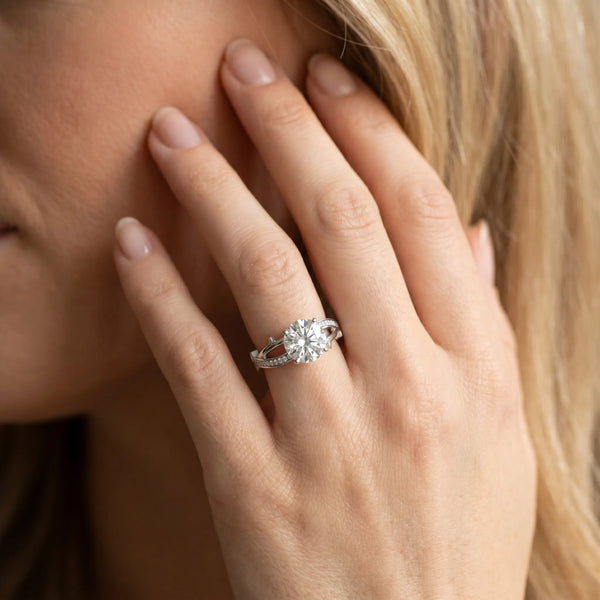White gold Round Solitaire Twist Band with Pavé Accents and Four-Prong Setting