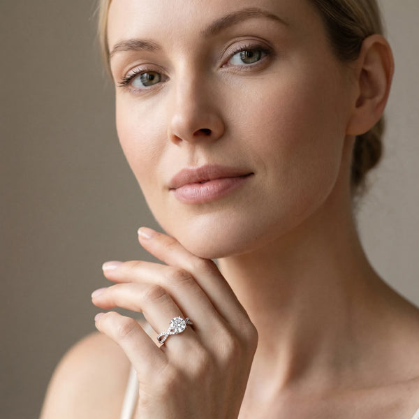 White gold Round Solitaire Twist Band with Pavé Setting and Four-Prong Mount