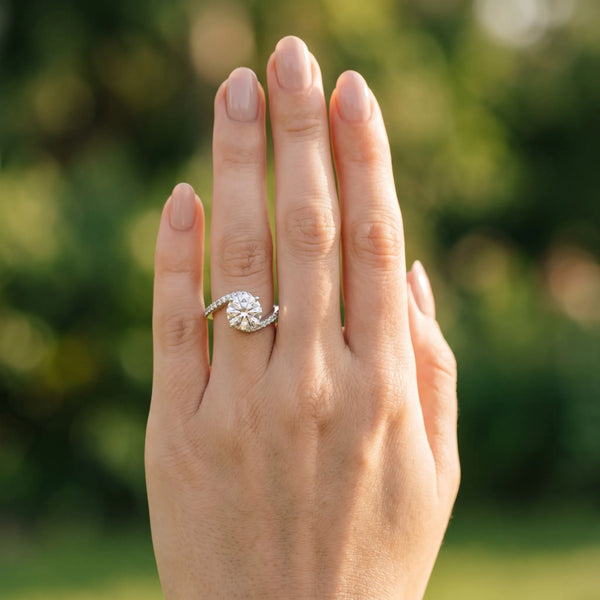 White gold Round Solitaire Twist Band with Pave Set Diamonds and Four-Prong Setting