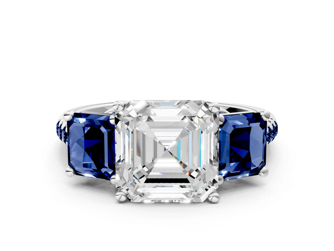 White gold Three-Stone Asscher Cut Diamond Ring with Round with Blue Sapphire side stone Pavé Band and Prong Setting