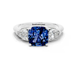 White gold Three-Stone Cushion Cut Blue Sapphire Ring with Pear Side Stones and Four-Prong Setting