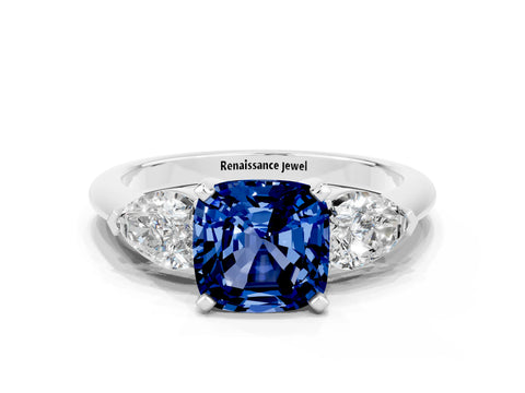 White gold Three-Stone Cushion Cut Blue Sapphire Ring with Pear Side Stones and Four-Prong Setting