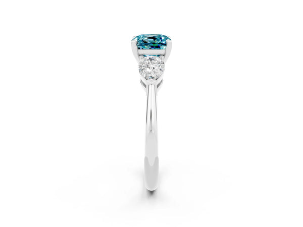 Platinum Three-Stone Cushion Cut Blue Topaz Ring with Pear Side Stones and Four-Prong Setting