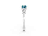 White gold Three-Stone Cushion Cut Blue Topaz Ring with Pear Side Stones and Four-Prong Setting_2