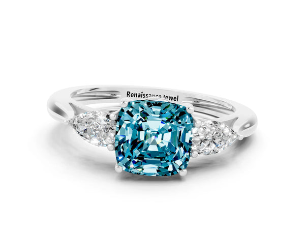 Silver Three-Stone Cushion Cut Blue Topaz Ring with Pear  Side Stones in Four-Prong Setting