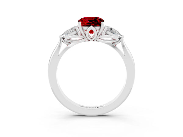 Platinum Three-Stone Cushion Cut Cut Diamond Ring with Pear Side Stones in Four-Prong Setting