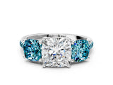 White gold Three-Stone Cushion Cut Diamond Ring with Round with Blue Topaz side stone Pavé Band and Prong Setting